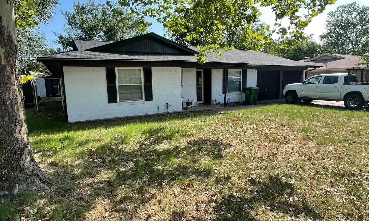 Professional roofing crew working on a residential roof in Balch Springs