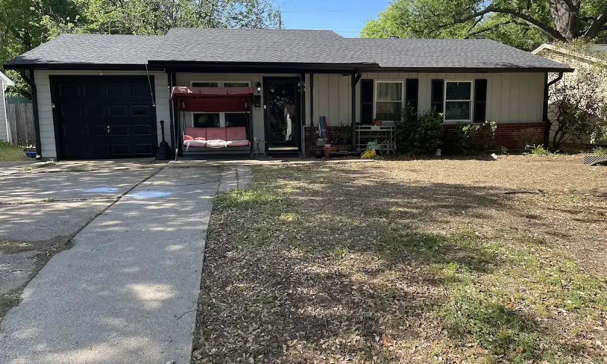 Wind Damage Roof Repair crew at work on a residential roof in Balch Springs